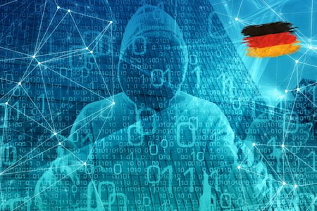 A cybercriminal in Germany in front of binary code and network connections.