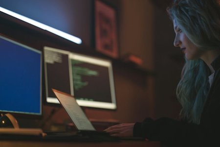 A woman working on her computer.
