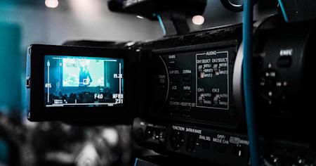 A camera recording footage in a studio.