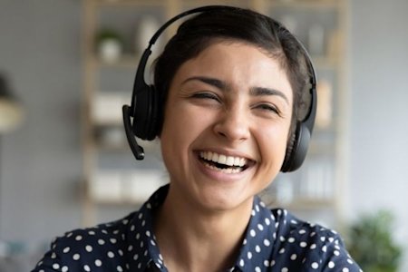 Joyful IT technician utilizing Splashtop's Remote Access for efficient IT help desk support