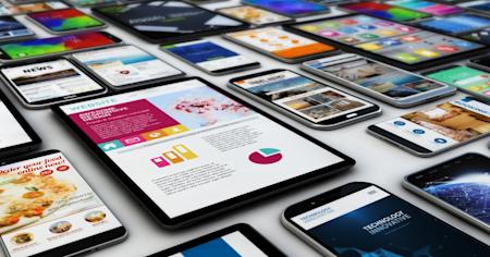 Multiple mobile devices on a flat surface, symbolizing mobile device management.