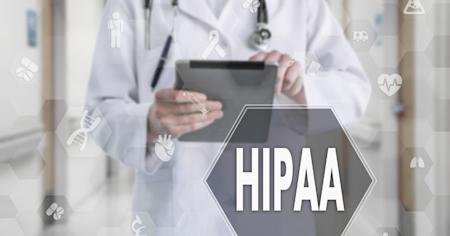 A doctor reviewing HIPAA compliance in his documents.