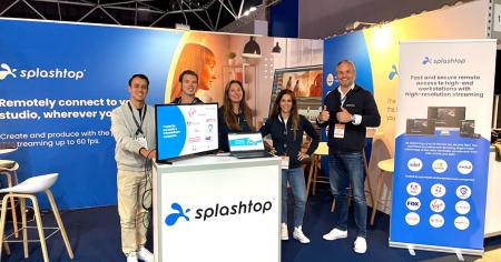 Splashtop employees stand at their booth at IBC2022 technology conference