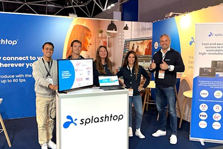 Splashtop employees stand at their booth at IBC2022 technology conference