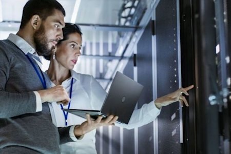 IT specialists using remote access, working together to safeguard the network from ransomware attacks