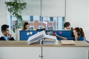 Four coworkers working in an office.