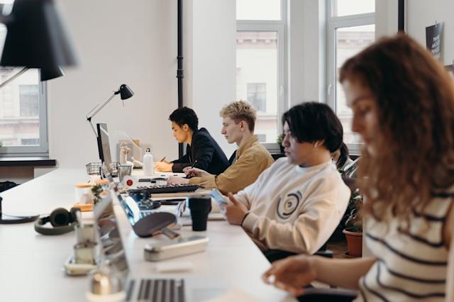 A team works on their computers in an office.