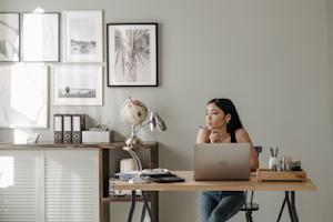 A person working remotely on their computer.