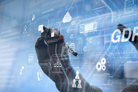 Hand interacting with a digital interface focusing on GDPR compliance