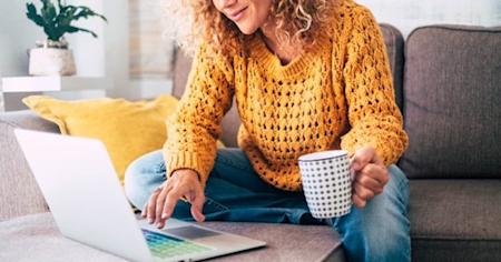 IT professional working remotely on a couch with Splashtop for seamless remote access