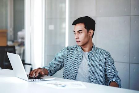 Man learning how IT is navigating the changing work environment with a distributed workforce