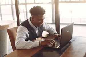 A man working remotely using Splashtop on a laptop.