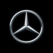 A silver three-pointed star enclosed in a circle, representing the Mercedes-Benz logo, on a black background.