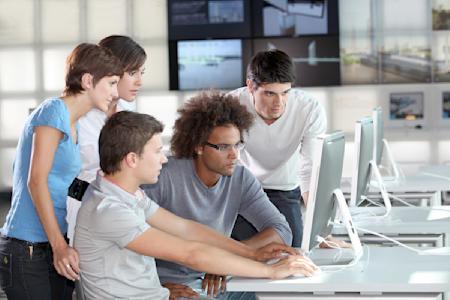 Students using computers at a school.