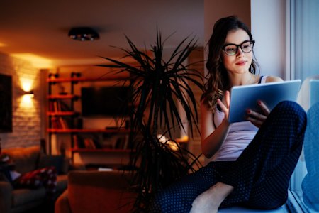 User working on a laptop at a home desk using Splashtop remote access software during the COVID-19 pandemic
