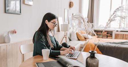 A remote employee using a laptop to work from home.