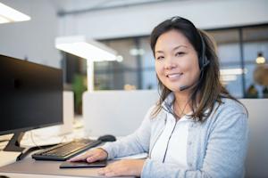 A smiling IT technician after providing remote support to a customer