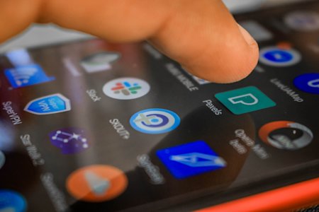 An android device being remotely accessed by an iPad.