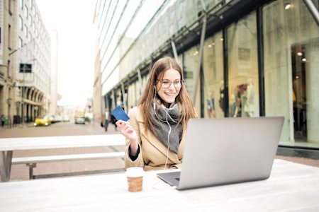 A woman on a laptop using Splashtop, the top program like TeamViewer