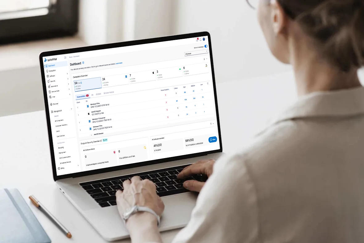 Hands typing on a laptop keyboard.