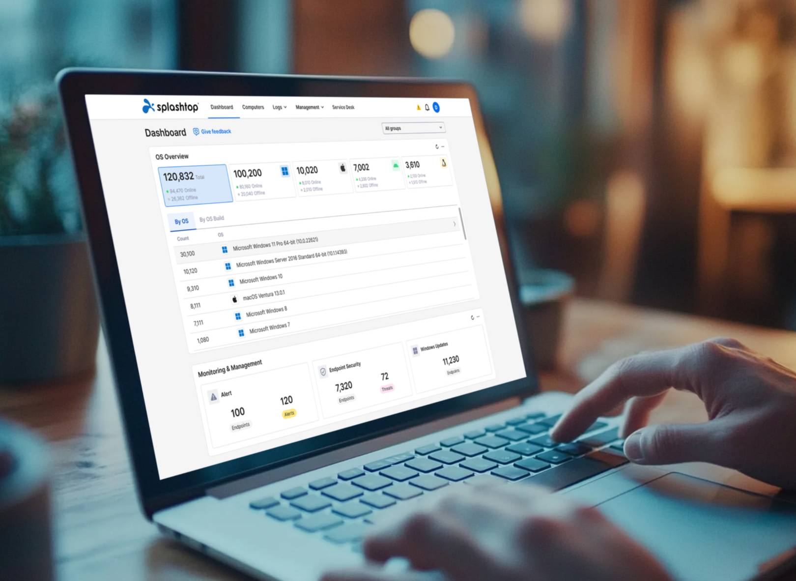 Hands typing on a laptop keyboard.