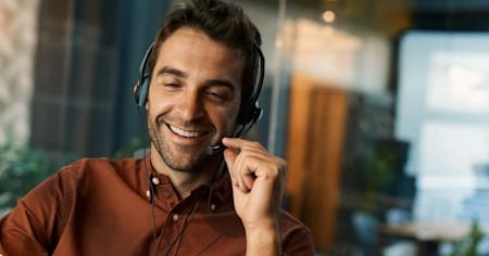 IT helpdesk professional providing remote support to a client via headset