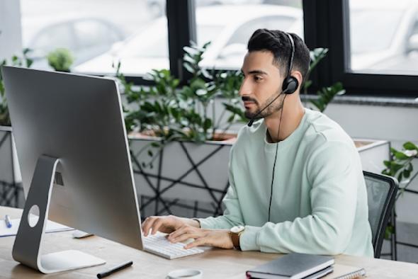 Man reading about the benefits of remote software for companies