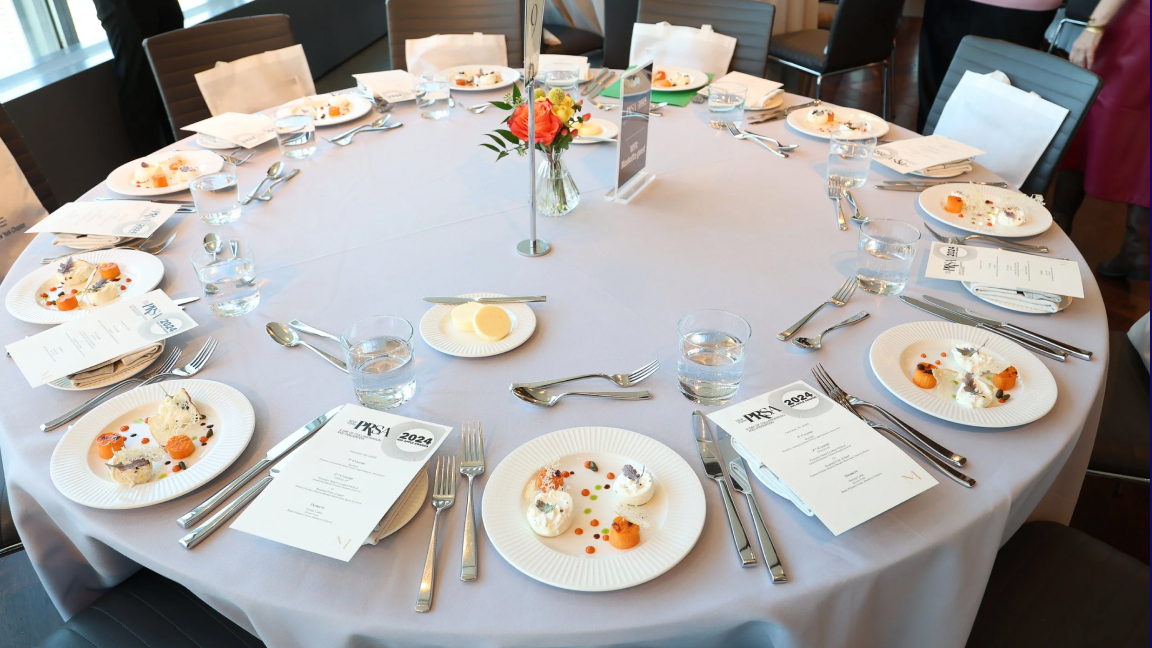 Our team worked closely with PRSA-NY, managing all visual aspects — printed and digital signage, table menus, banners, awards, and more 🎨. Each piece was designed to maintain a cohesive aesthetic while capturing the energy of the awards. From stage elements to table displays, every detail was carefully considered to create a seamless experience for attendees ✨.