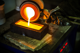 Gold bullion bar being poured 