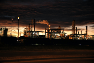 A refinery operating at sunset