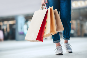 Retail - closeup - Woman holding sale shopping bags