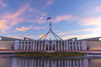 Politics - a sunset view of federal parliament house at canberra in the act, australia