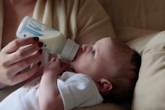 Baby being fed milk