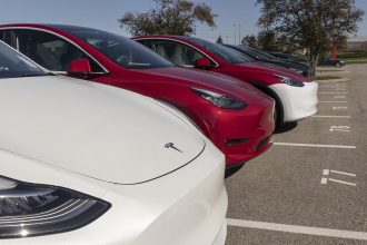 A row of Tesla EVs
