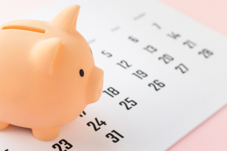 Super - Money pig and calendar on pink background. Deadline, business, finance concept