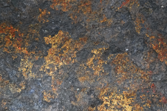 An image depicting copper-coloured mineralisation within a host rock