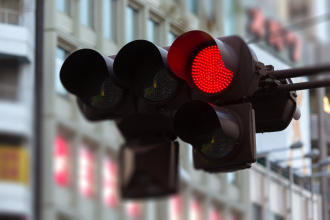 Traffic lights showing a red light for stop over an intersection in the US 