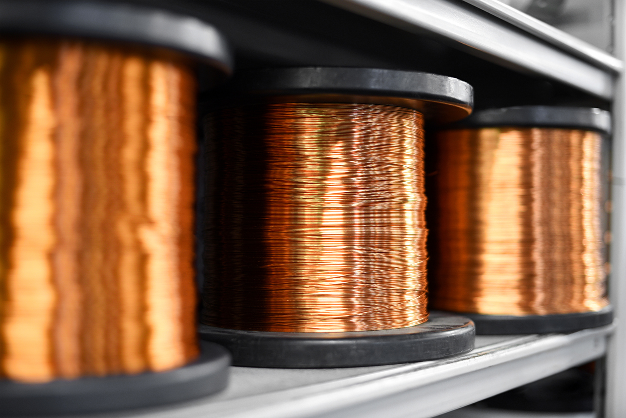 Coils of shiny copper on shelf