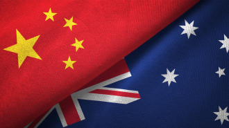 A depiction of the Chinese flag and the Australian flag in close contact, representing a close relationship between both countries 