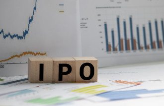 IPO 4 - wooden blocks on documents spelling out IPO