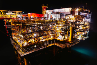 An offshore gas platform photographed at night, located in the North Sea. Norway will become a major supplier of gas to the EU; much of its gas comes from the North Sea. Owner of platform pictured unclear