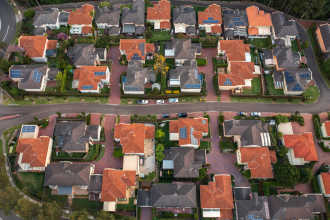 An aerial photograph, probably taken by drone, of a residential suburb in an unknown location