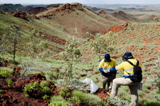 2011 Geologists sampling rocks in iron ore exploration in the Outback