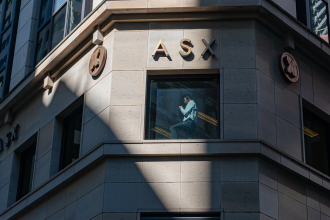 A man at the window talking on the phone at ASX Australian Securities Exchange