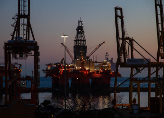 Image of an offshore rig in a port bay 