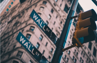 Wall Street sign with traffic light