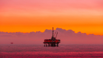 Oil rig with a red sunset 
