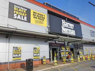 Harvey Norman retail store with black Friday sale sign 