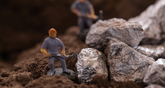 Nickel rocks with little miner figurines 