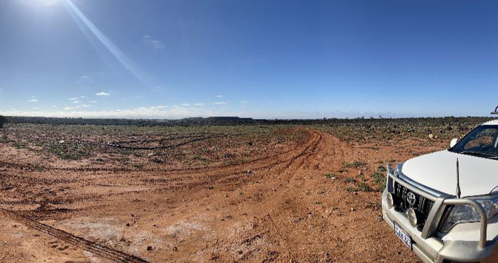 Exploration Activity with Bald Hill mine in background